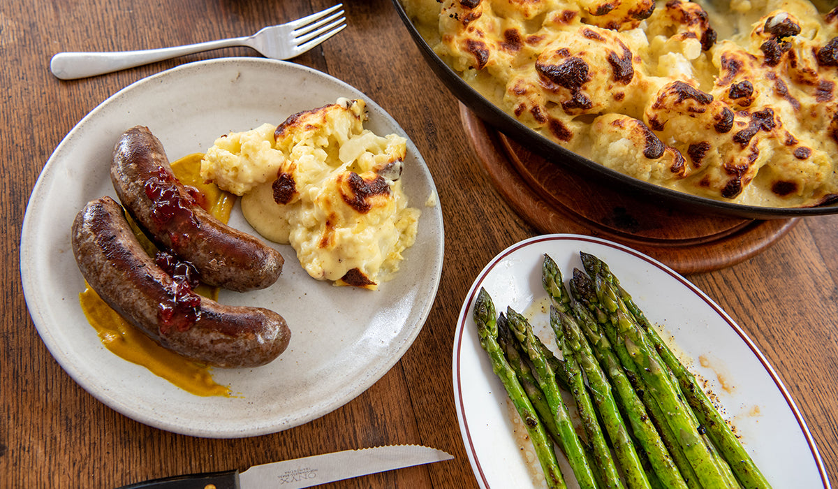 Venison sausages with cauliflower cheese