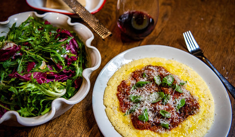 Italian sausage meatballs in sugo with polenta