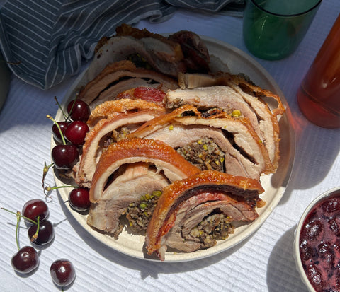 Porchetta with Sage + Pistachio stuffing + Glazed cherries