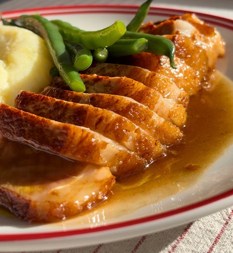 Pork chop with pan cider gravy, mash & long beans