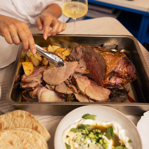Certified Organic saltbush lamb leg roast on a steel bench at Hagen's Organics